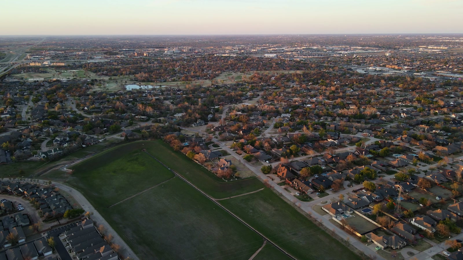 Aerial view of rooftops across a Tulsa neighborhood